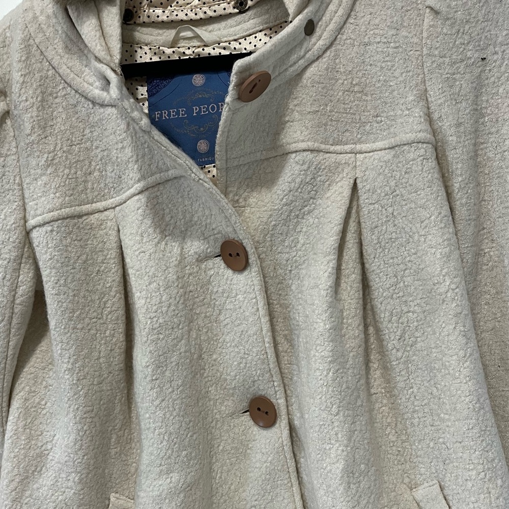 Free People Peacoat w hood. It’s lined.